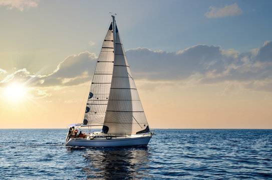 Sail boat on the ocean with clear skies.